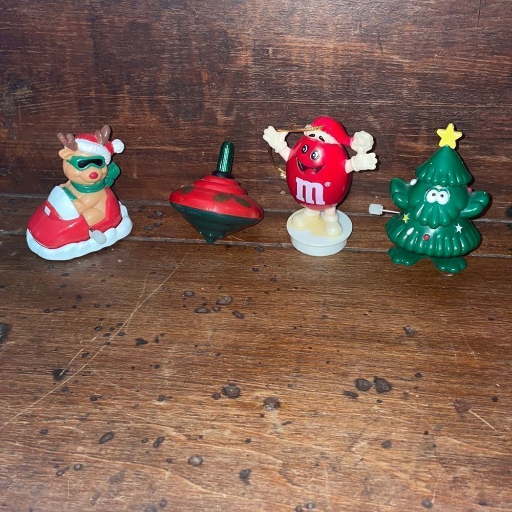 Collection of 4 plastic M & M ornament, wind up toys & top‎